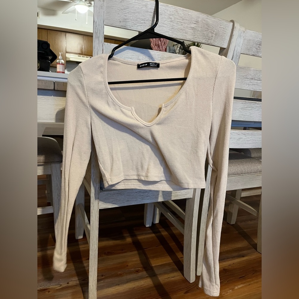Cream long sleeved cropped top